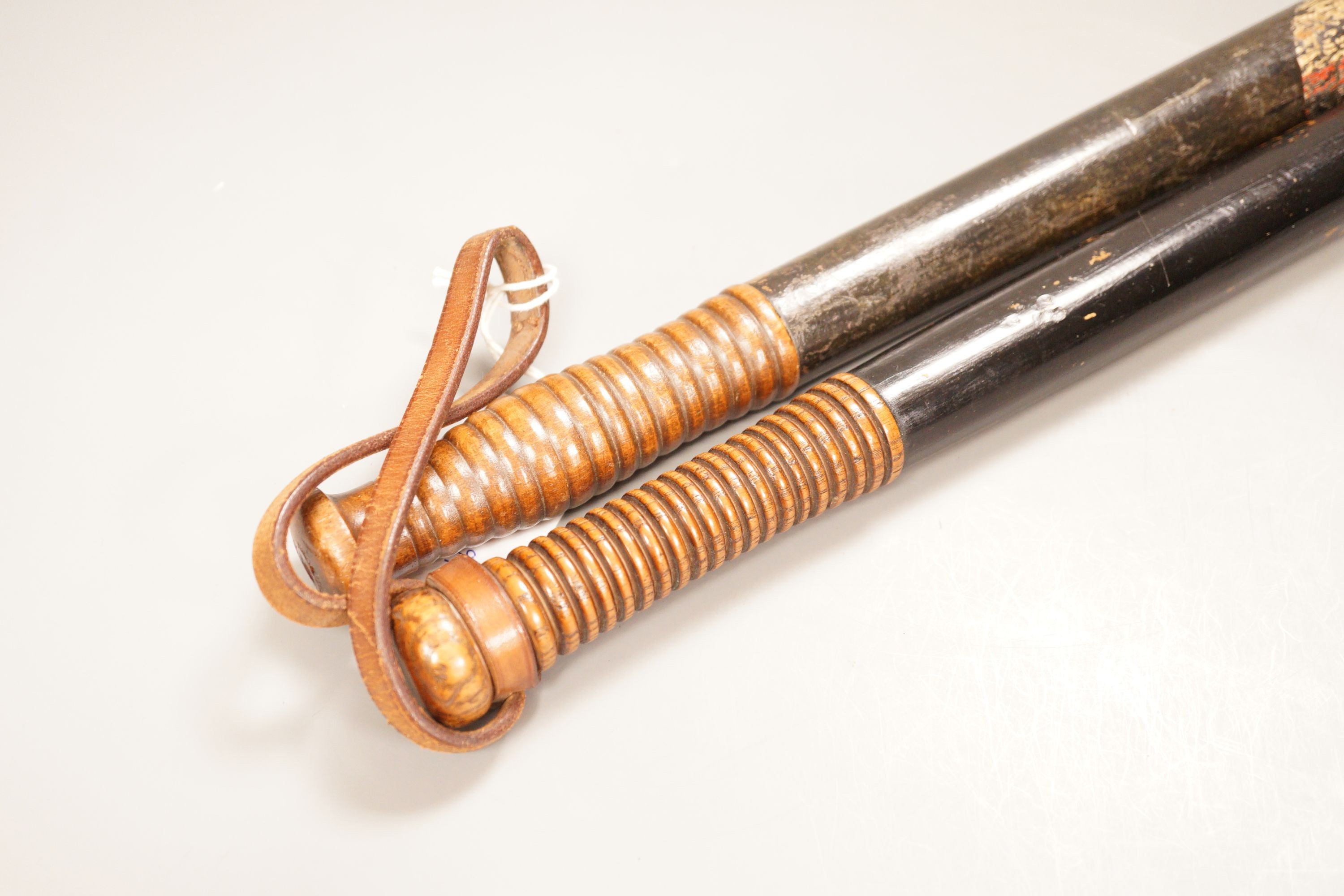 Two Victorian painted truncheons, one ‘Sergt. 21 E.S.C’, the other painted with St. George’s cross, 47cm